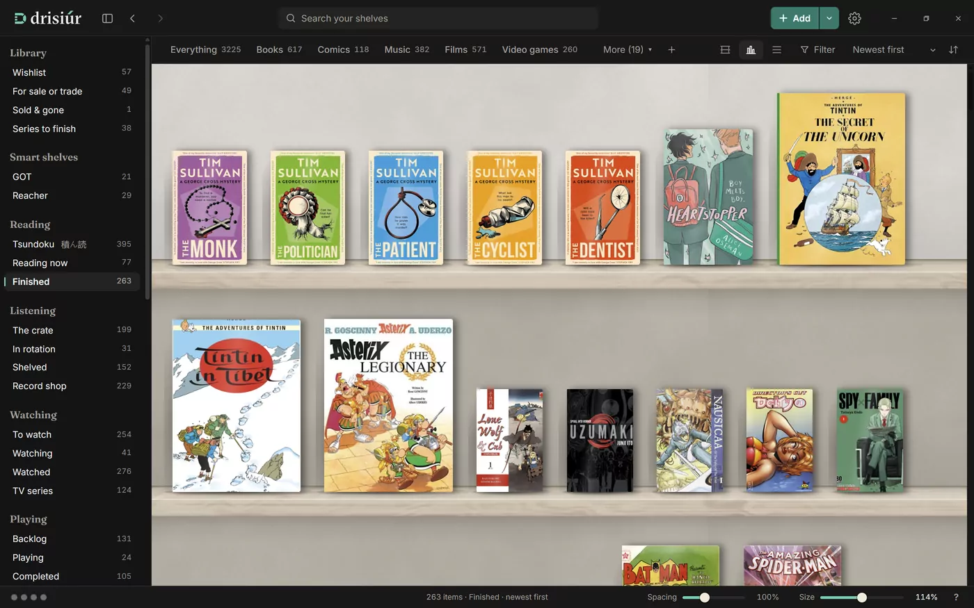 Drisiúr on a computer, showing a shelf of finished books in the Gallery finish: pale oak planks on soft plaster, in daylight, each cover standing at its real size.