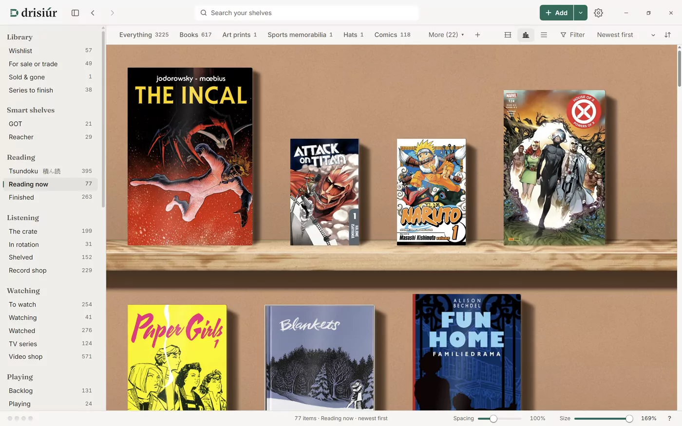 The Reading now shelf with Drisiúr’s window set to Light: a pale toolbar and sidebar around a wooden bookcase of comics and books.