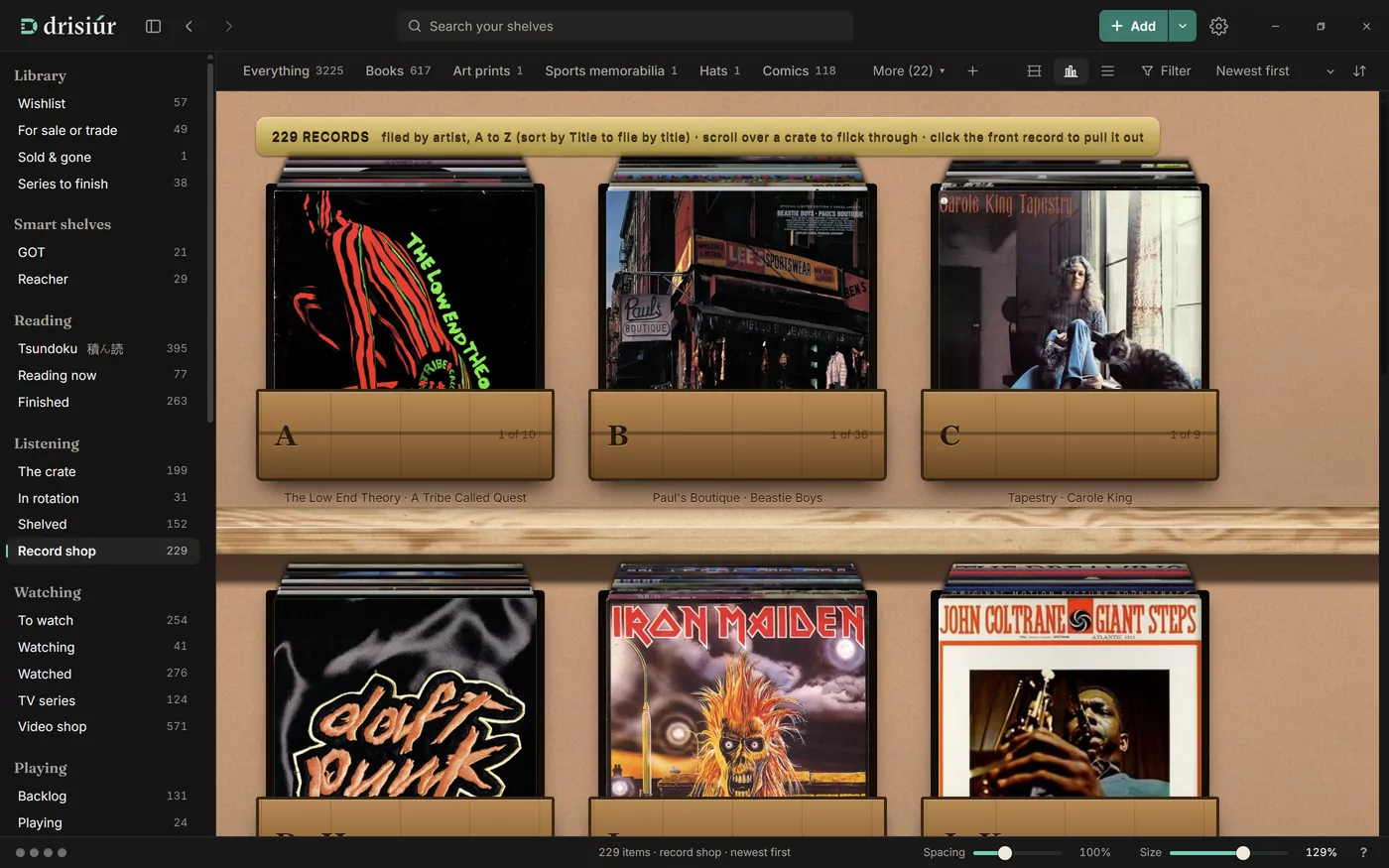 The record shop: records filed by artist into wooden crates labelled with letters, each with its front record showing.